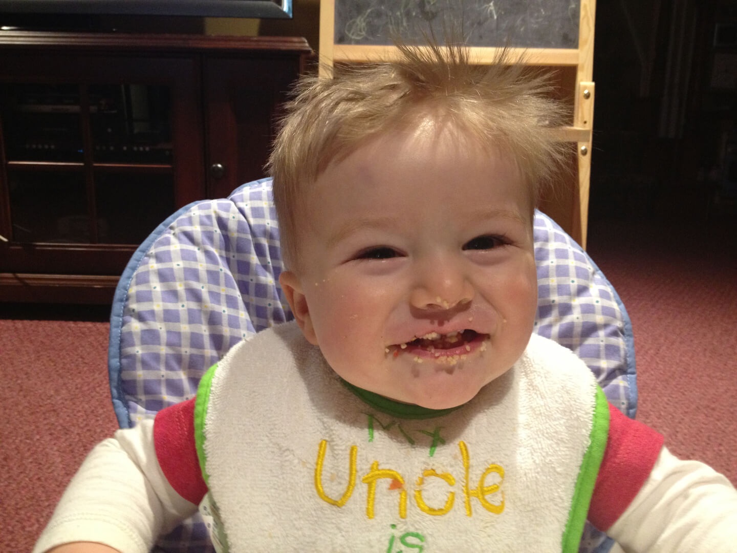 Smiling kid with crumbs on his face