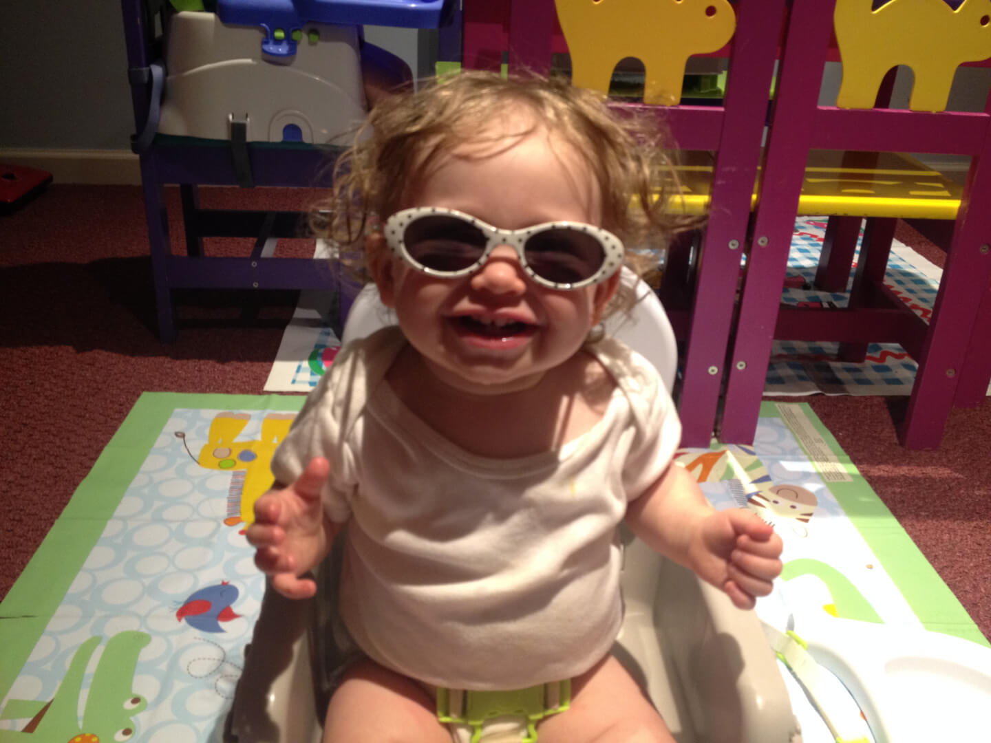 Toddler wearing white glasses