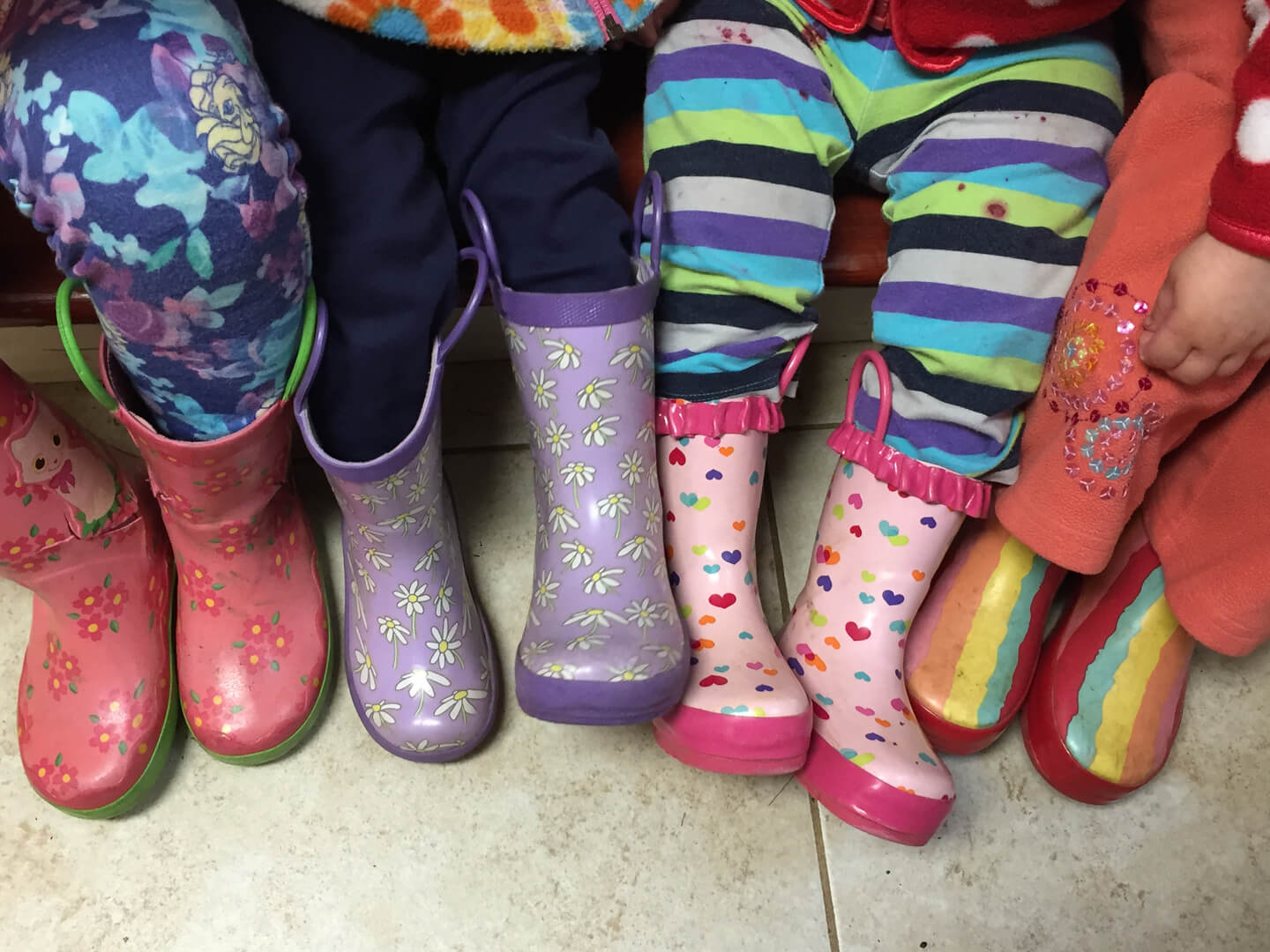 Children wearing colorful rainboots