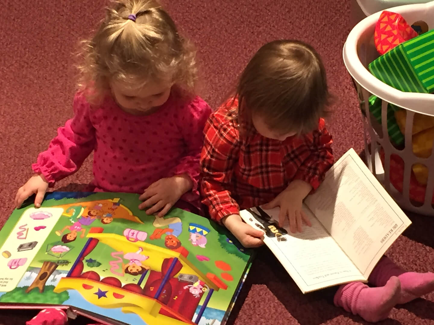 Two kids reading books